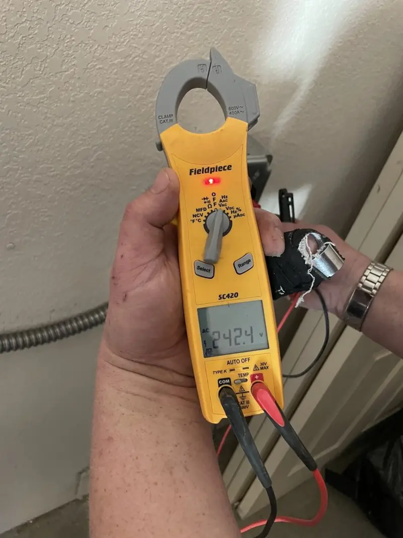 Voltage testing with clamp meter during Generator Installation in Orland